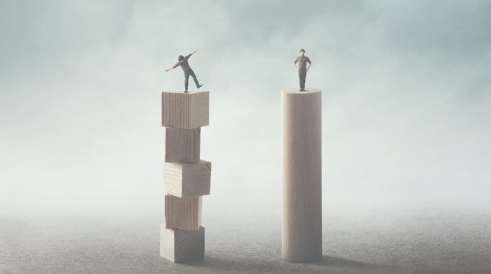 A person standing on an unstable tower next to a person standing firmly on a stable tower. The graphic symbolizes how Enterprise Architecture Supports Operational Consistency and Stability